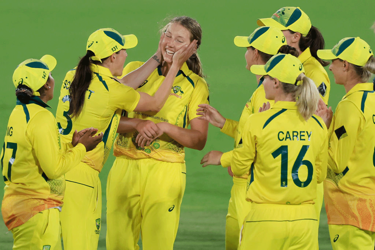 Australia's Darcie Brown celebrates with team mates after taking the wicket of England's Sophie Ecclestone during game one of the Women's Ashes One Day International series between Australia and England at Manuka Oval in Canberra on Thursday