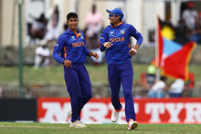 India's skipper Yash Dhull and teammate Kaushal Tambe celebrate the dismissal of England's Alex Horton during the final.