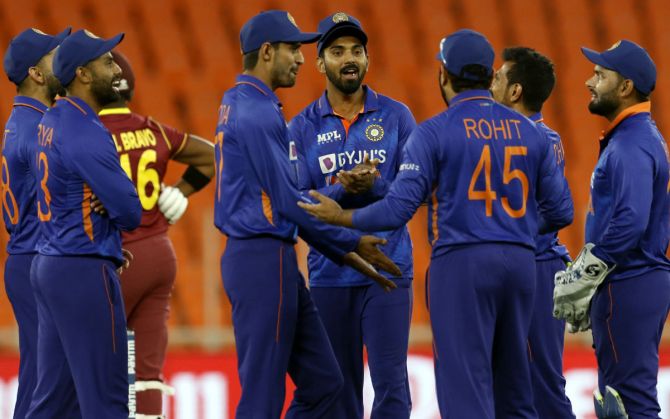 India's players celebrate the wicket of Darren Bravo.