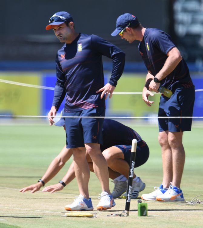 South Africa's captain Dean Elgar takes a close look at the pitch for the second Test against India during Sunday's training session, at the Imperial Wanderers Stadium in Johannesburg. 