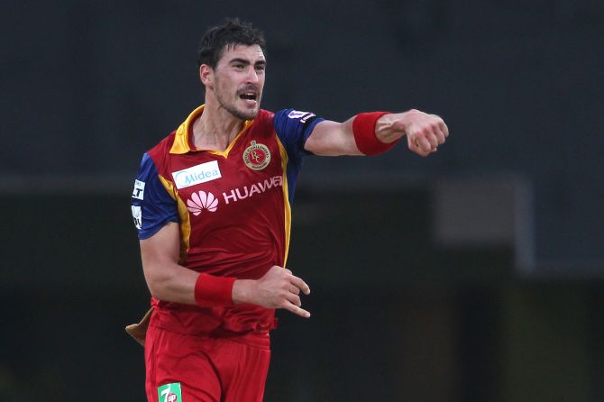 Royal Challengers Bangalore pacer Mitchell Starc celebrates after taking a wicket during IPL 2015