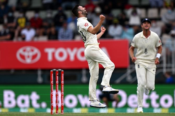 England pacer Mark Wood celebrates dismissing Australia's Mitchell Starc during Day 3 of the fifth Ashes Test, at Blundstone Arena in Hobart, on Sunday.