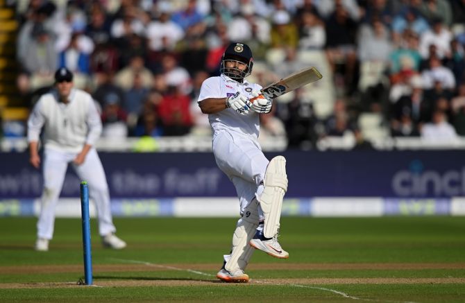 India's Rishabh Pant dances down the wicket to hit England spinner Jack Leach for six runs, as Sam Billing looks on during Day 1 of the fifth Test at Edgbaston, in Birmingham, on Friday.