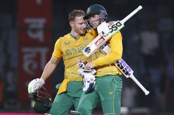 David Miller and Rassie van der Dussen celebrate winning the first T20 International against India