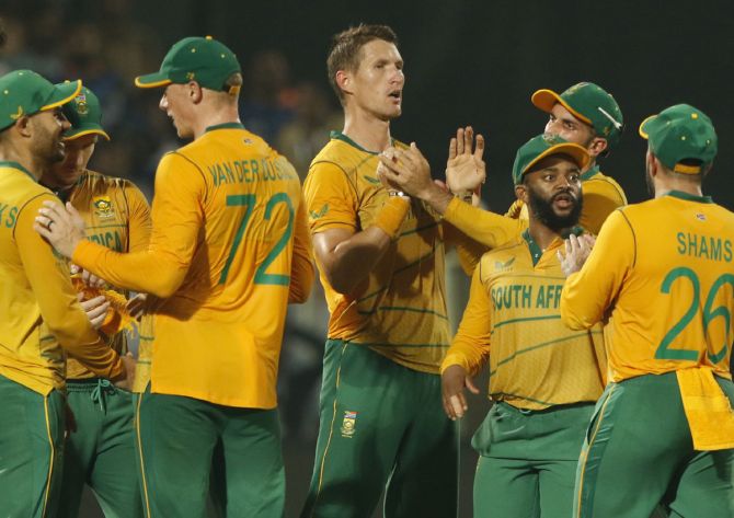 Dwaine Pretorius of South Africa celebrates the wicket of Ishan Kishan