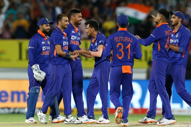 Harshal Patel celebrates with his India teammates after dismissing South Africa's Quinton de Kock during the 4th T20I at the Saurashtra Cricket Association Stadium, in Rajkot, on Friday.