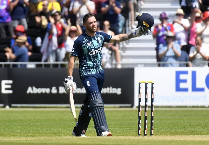 Phil Salt waves to the crowd after reaching his century.