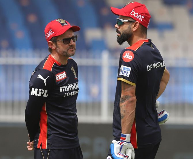 Royal Challengers Bangalore Director of Cricket Operations Mike Hesson and Virat Kohli during a training session.