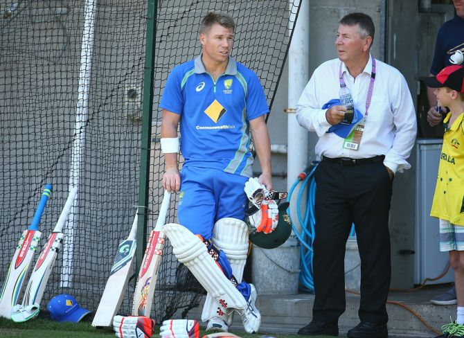 David Warner chats with Rod Marsh, former chairman of selectors, during an Australia nets session at the Melbourne Cricket Ground on December 24, 2015.
