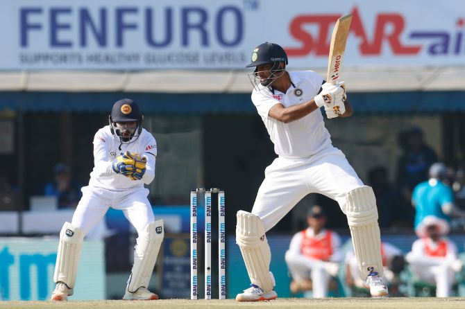 Ravichandran Ashwin dispatches the ball to the boundary during his 61-run knock off 82 balls.