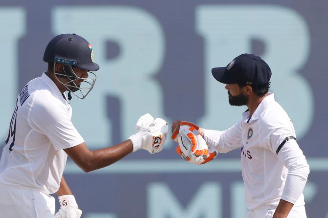 Ravindra Jadeja and Ravichandran Ashwin celebrate a boundary 