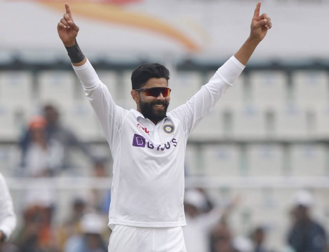 India spinner Ravindra Jadeja raises his arms in triumph after taking a wicket on Day 3 of the first Test against Sri Lanka, in Mohali, on Sunday.