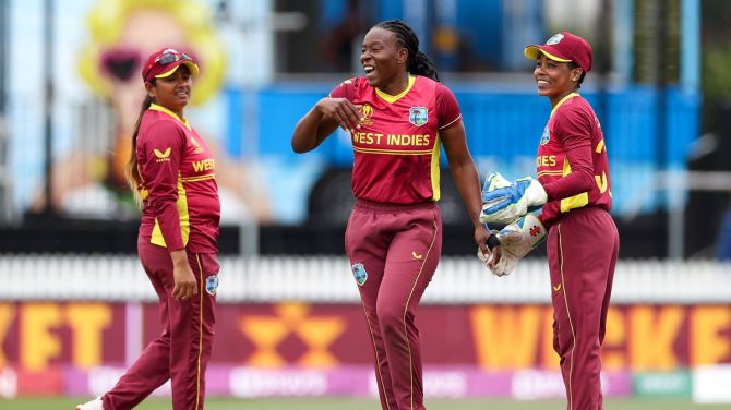 Shakera Selman celebrates with her West Indies teammates Anisa Mohammed, left, and Shemaine Campbelle after dismissing Yastika Bhatia.