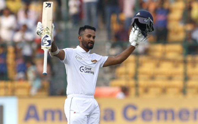 Sri Lanka skipper Dimuth Karunaratne celebrates scoring a hundred.