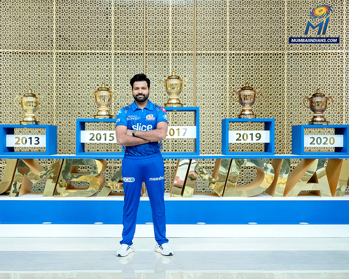 Mumbai Indians' captain Rohit Sharma poses with his five trophies