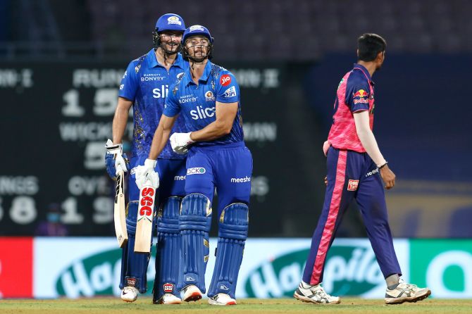 Daniel Sams and Tim David celebrate after steering Mumbai Indians to a tense victory over Rajasthan Royals in the IPL match at the DY Patil Stadium in Navi Mumbai on Saturday.