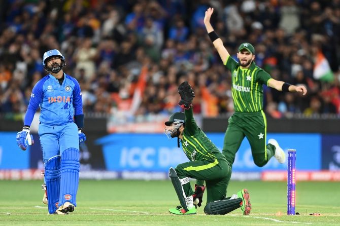 Dinesh Karthik of India is stumped by Mohammad Rizwan of Pakistan