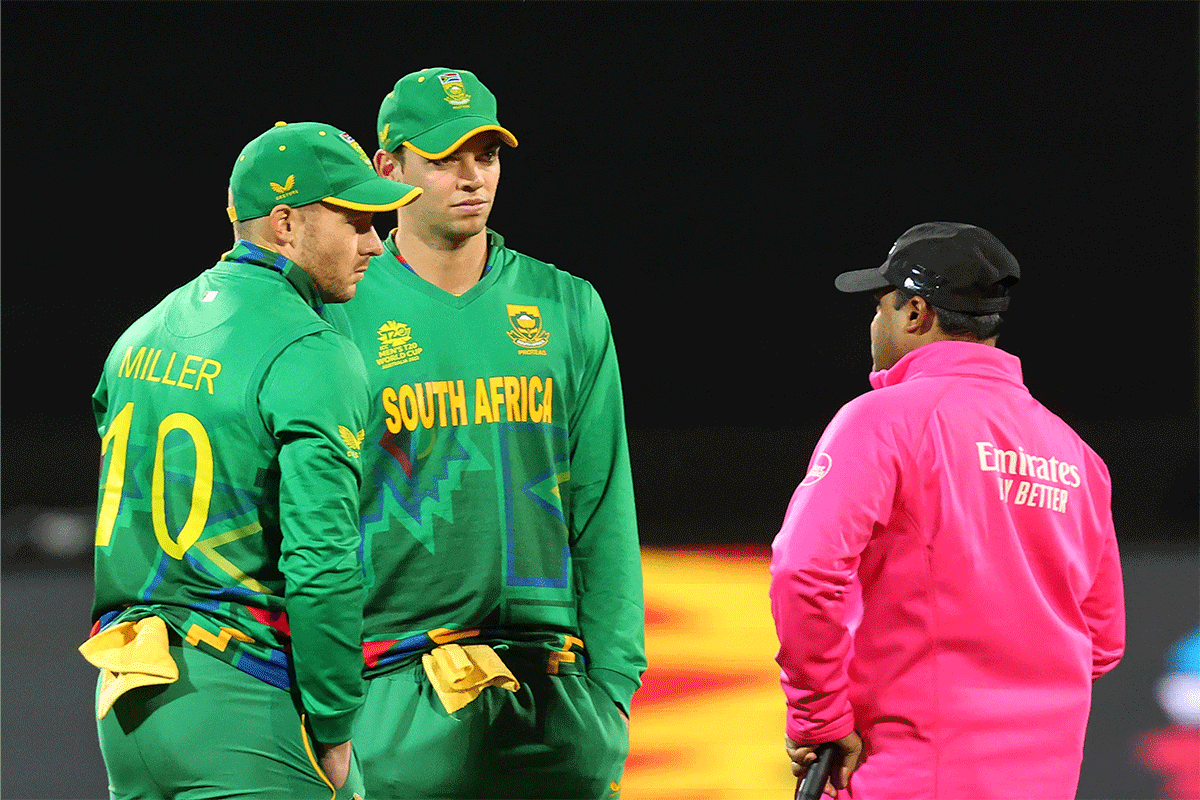 South Africa's David Miller speaks to the umpire during a rain interruption during the match against Zimbabwe on Monday