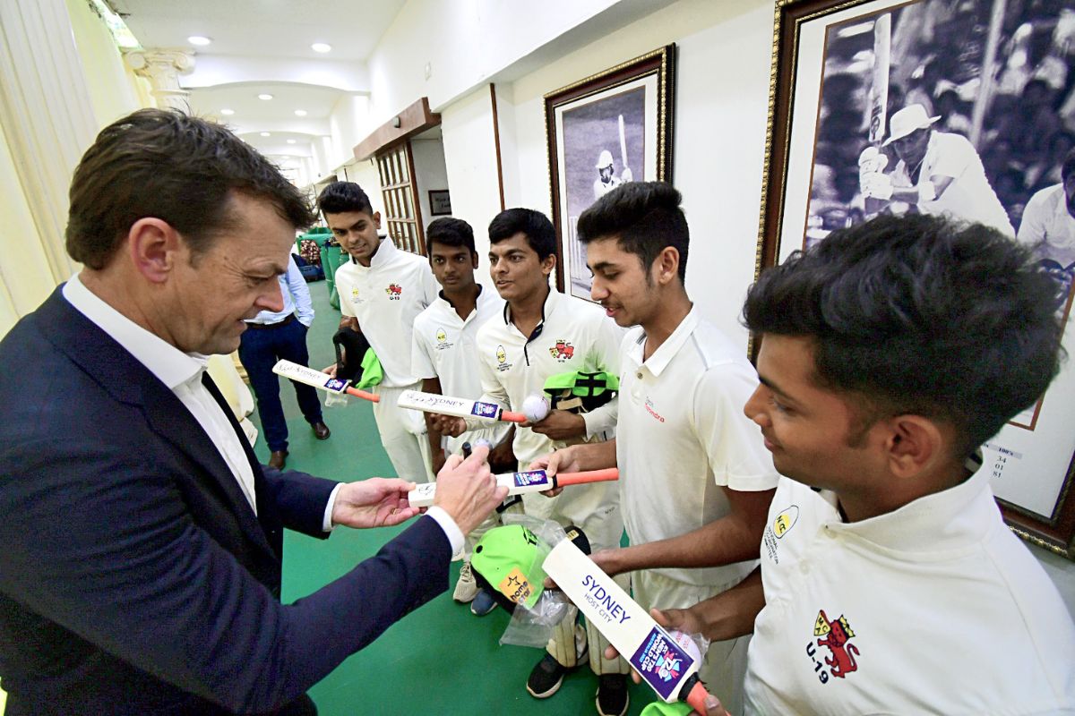  Australian Former Cricketer Adam Gilchrist gives autographs to young cricketers