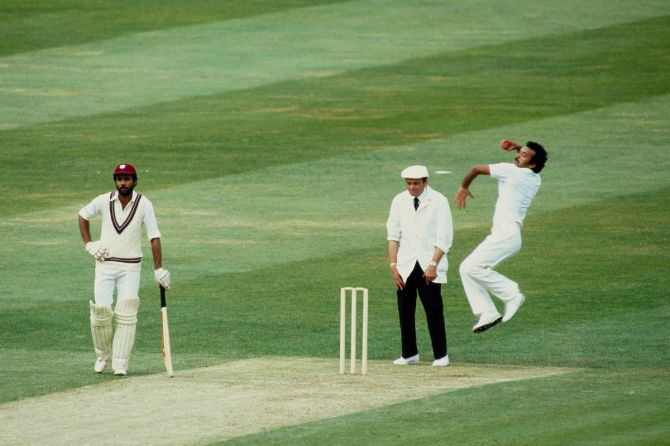  India bowler Madan Lal in bowling action as West Indies batsman Jeffrey Dujon and umpire Harold Dickie Bird look on from the non strikers end