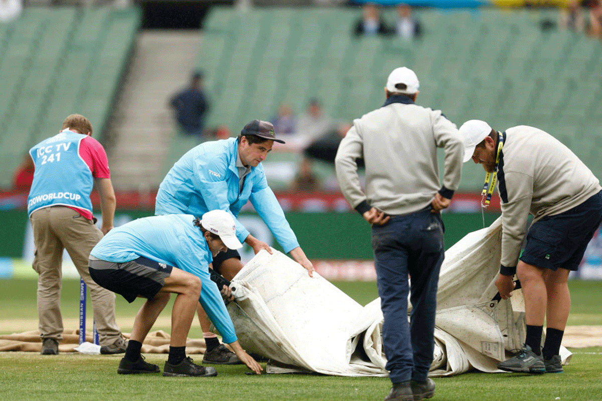 Ground Staff pull out rain covers before the ICC Men's T20 World Cup match between England and Ireland at Melbourne Cricket Ground on Wednesday