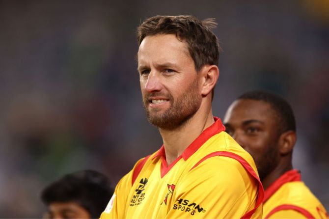 Craig Ervine of Zimbabwe looks on before taking to the field