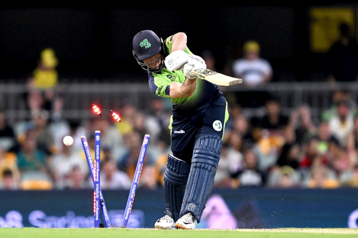 Ireland's Curtis Campher is clean bowled by Australia's Mitchell Starc