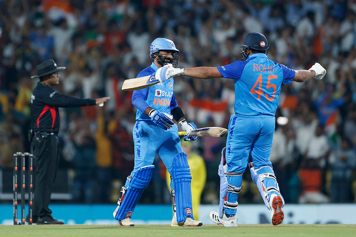 India's Dinesh Karthik and Rohit Sharma celebrate after winning the 2nd T20I match against Australia, at Vidarbha Cricket Association Stadium in Nagpur on Friday