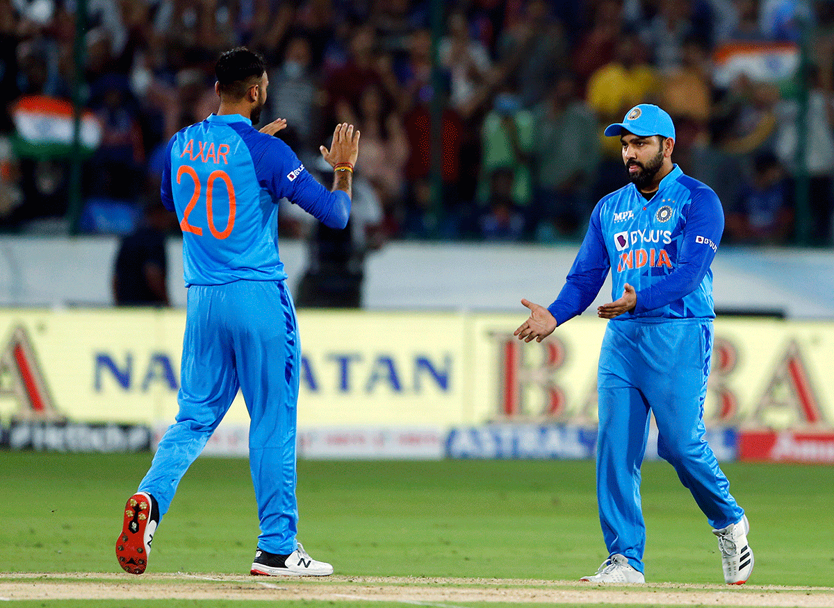 Axar Patel and Rohit Sharma celebrate the wicket of Aaron Finch