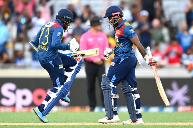 Kusal Mendis and Charith Asalanka celebrate after Sri Lanka beat New Zealand via the Super Over in Game 1 of the T20 International series, at Eden Park, Auckland, on Sunday.
