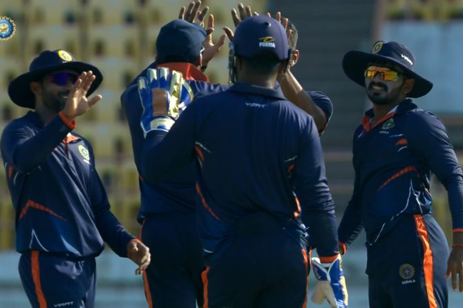 Kerala players celebrate a fall of a wicket during a match against Maharashtra during the Vijay Hazare Trophy on Saturday
