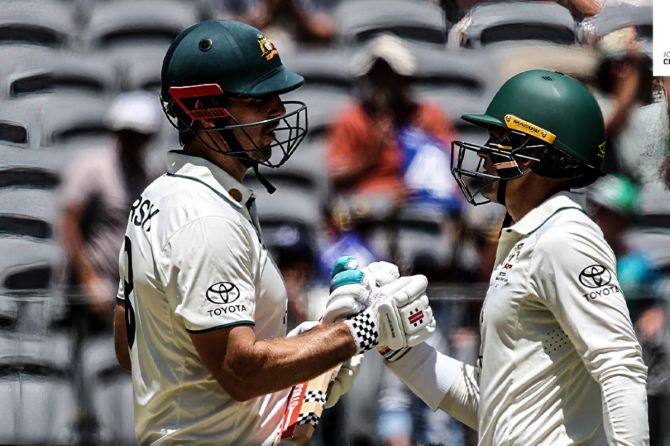 Mitchell Marsh and Alex Carey added 130 runs to Australia's overnight for the loss of two wickets
