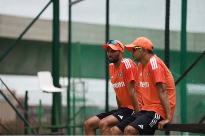 Indian Head coach Rahul Dravid speaks with bowler Prasidh Krishna at a nets session on Saturday. It was baptism by fire for debutant Krishna who conceded 93 runs in 20 overs and took just a single wicket