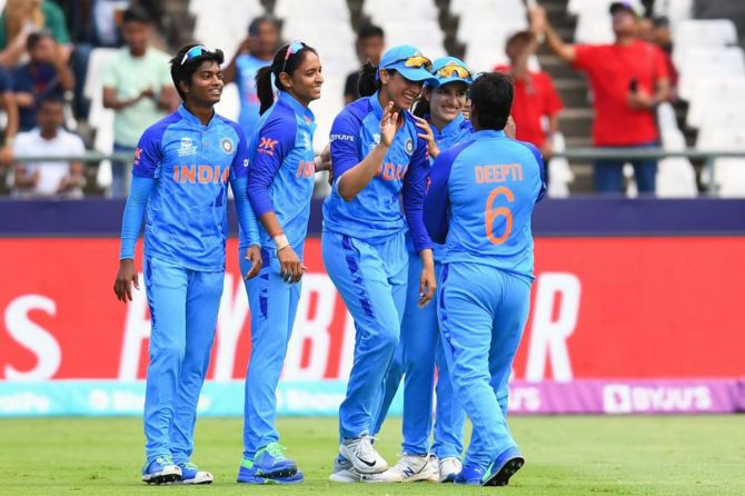 Deepti Sharma gets a round of high-fives from her India teammates after dismissing the West Indies' Shemaine Campbelle during women's World Cup match, at Newlands Stadium, in Cape Town, on Wednesday. 