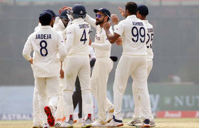 India's players celebrate after Ravichandran Ashwin dismisses Steve Smith.