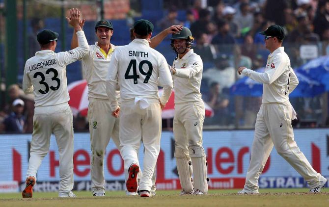Australia's players celebrate after Todd Murphy dismisses Axar Patel.