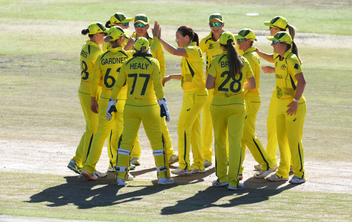 Australia's Megan Schutt celebrates with teammates after dismissing India's Shafali Verma
