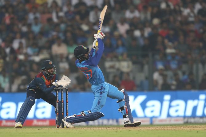 Deepak Hooda hits over the top for six during the first T20 International against Sri Lanka, at the Wankhede Stadium, in Mumbai, on Tuesday.