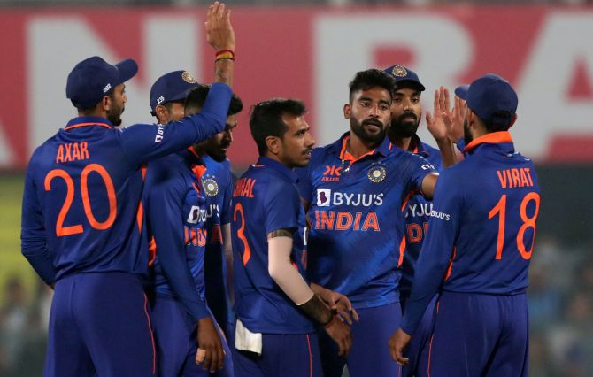 Mohammed Siraj celebrates with team-mates after taking the wicket of Avishka Fernando.