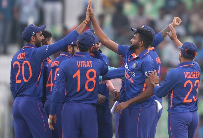 Mohammed Siraj celebrates with team-mates after taking the wicket of Avishka Fernando