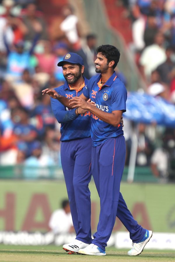 India's skipper Rohit Sharma congratulates Washington Sundar on dismissing Glenn Phillips.