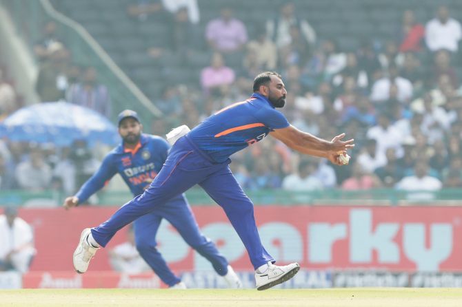Mohammed Shami takes a caught and bowled chance to send New Zealand's Daryl Mitchell back.