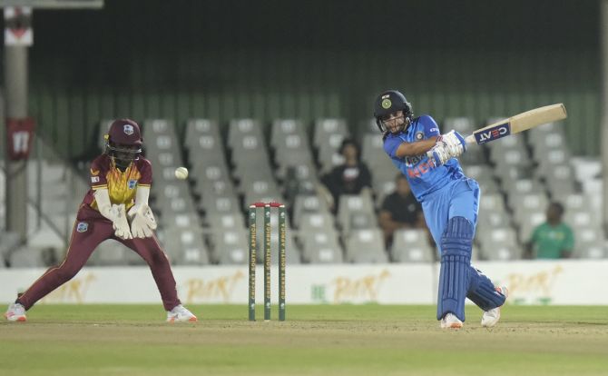 Harmanpreet Kaur steps out and sends the ball to the boundary during the women's T20I Tri-Series match against the West Indies, at Buffalo Park, in East London, South Africa, on Monday.