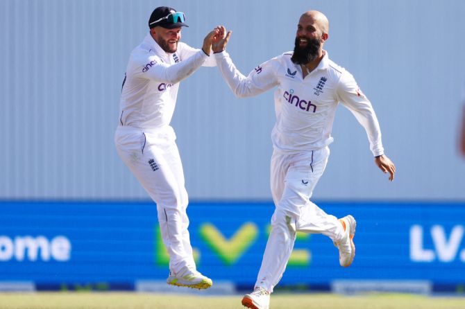 England's Moeen Ali celebrates with Ben Duckett after taking the wicket of Australia's Steve Smith.