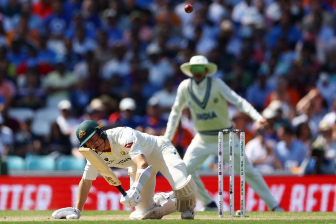 Australia's Marnus Labuschagne goes to ground after being hit by a Mohammed Siraj delivery.