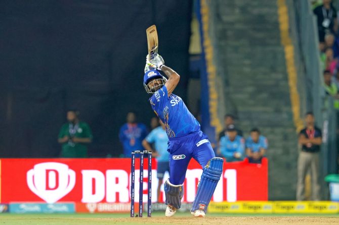 Suryakumar Yadav sends the ball into the stands during his blazing 49-ball 103, which included 11 fours and 6 sixes, against Gujart Titans