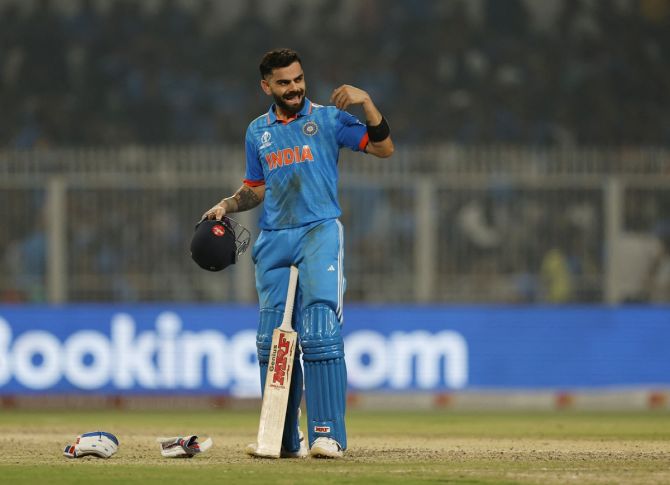 Virat Kohli reacts as he celebrates scoring his 49th ODI hundred during the ICC World Cup match against South Africa at the Eden Gardens in Kolkata on Sunday.