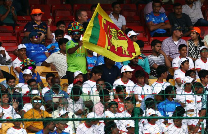 A Sri Lanka fan displays a flag in the stands during the team's ICC World Cup match against India at the M. Chinnaswamy Stadium, Bengaluru, on October 26, 2023.