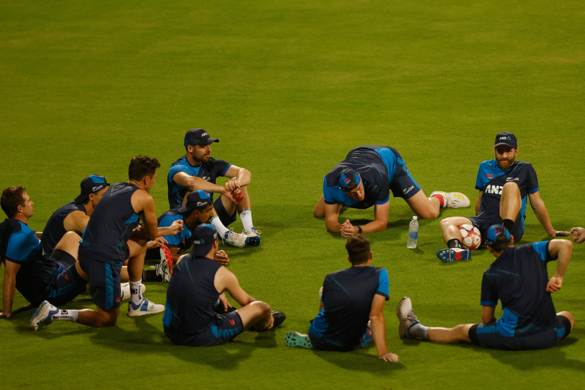 The New Zealand cricket team take a break during a practice session at the Wankhede Stadium in Mumbai on Monday