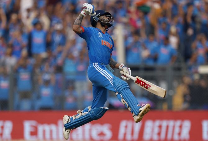 Virat Kohli celebrates scoring his 50th century and breaking Sachin Tendulkar's record of most ODI hundreds, during the World Cup semi-final against New Zealand, at the Wankhede stadium on Thursday.
